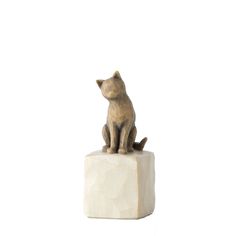 a statue of a cat sitting on top of a block of white marble, against a white background