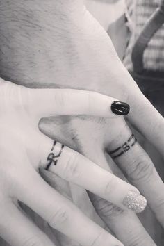 two people with wedding rings on their fingers