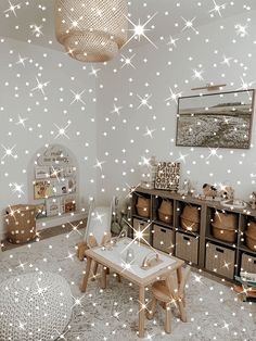 a child's room with stars on the wall and furniture in front of it