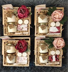 three wooden boxes with candles and flowers in them sitting on a furnishing floor