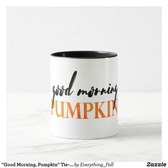 a white and black coffee mug with the words good morning pumpkin on it's side