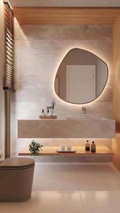 a bathroom with a toilet, sink and mirror in it's center wall area