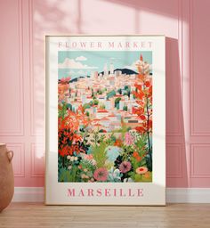 a flower market poster hangs on the wall in front of a vase and pink walls