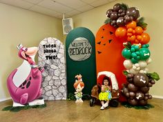 an office decorated for halloween with balloons and decorations in the shape of cartoon characters,