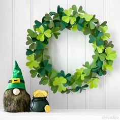 a st patrick's day wreath, potted shamrocks and a green gnome hat