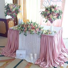 the table is covered with pink and white flowers