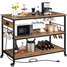 a microwave oven sitting on top of a wooden shelf filled with bottles and wine glasses