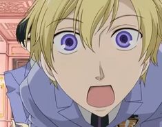 an anime character with blonde hair and blue eyes making a surprised face while looking at the camera