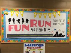 a bulletin board with children's activities on it in front of a brick wall