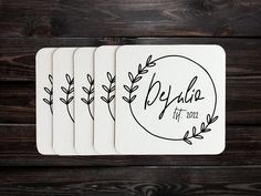 four coasters with the words beula written in black ink on top of them