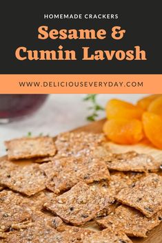 homemade crackers with oranges on the side and text overlay that reads sesame & cumin lavosh