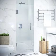 a white bathroom with marble walls and floor