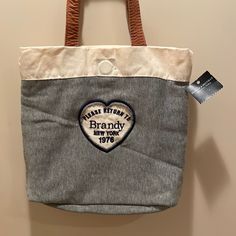 Brandy Melville Canvas (Cotton) Tote With Leather Straps. Has Embossed Logo With Writing “Please Return To Brandy New York 1976” On Front. New. Never Used. Small Tote, Embossed Logo, Cotton Totes, Womens Tote Bags, Brandy Melville, Brandy, Leather Straps, Size 10, New York