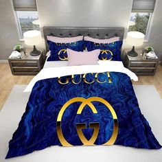 a bed with a blue comforter and matching pillows