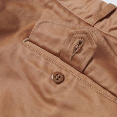 This double pleat front chino short from Buzz Rickson’s has been influenced by an archival military piece from the early 20th Century, and just like their reference, these shorts have been built to last! Cut from a 100% cotton, 8.2 ounce chino, this breathable wide leg short offers a high rise, and plenty of heritage charm. A ‘Talon’ zipper has been used for the front closure, while a mil spec button has been added to the waistband. Two rear pockets have been protected by decorative button flaps Buzz Rickson, Technical Skills, Mil Spec, Cotton Chinos, Chino Pants, Clothing Co, Chino Shorts, Chinos Pants, Early 20th Century