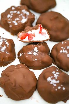 chocolate covered desserts are arranged on a plate