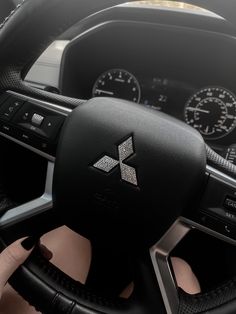 the steering wheel and dashboard of a car