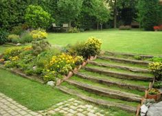 an outdoor garden with steps leading up to it