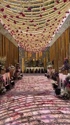 an elaborately decorated hall with floral decorations