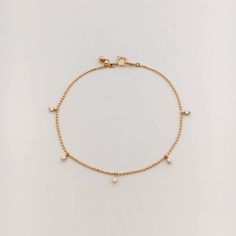 A delicate and ultra feminine white diamond bracelet which you can adjust to the perfect size between 6 to 7 inches. This bracelets stands out all on it's own. Details: 18k solid Rose Gold 5 White diamonds toal 0.19 cts. Adjustable size 6-7 inches Also available as a necklace https://www.etsy.com/listing/484458707/diamond-droplet-necklace-white-diamond?ga_search_query=droplet&ref=shop_items_search_1 Delicate Diamond Bracelet With Accents, Elegant Bracelet With Delicate Dangle Chain, Elegant Dangle Bracelets With Delicate Chain, Elegant Dangle Bracelet With Delicate Chain, Dainty Adjustable Diamond Cut Diamond Bracelet, Dainty White Gold Diamond Bracelet With Adjustable Chain, Cubic Zirconia Dangle Bracelets, Delicate Diamond Bracelet, Bracelet Stand