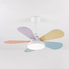 a white ceiling fan with multicolored blades hanging from it's light fixture