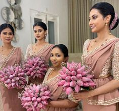 the bridesmaids are holding pink flowers in their hands