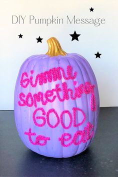 a purple pumpkin with writing on it that says, gummy something good to eat