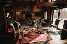 a living room filled with furniture and a fire place