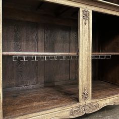 an old fashioned wooden cabinet with shelves and metal bars on the bottom, is shown in this image