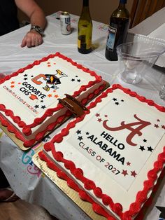 two birthday cakes are sitting on a table