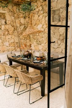 a dining table set up with place settings