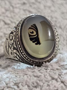 We show you a very old ring Onyx stone with a very clear picture of a fish One of the most requested stones because it is 100% natural. A mixture of colors on a stone of white Yemeni agate, one of the most beautiful stones, handmade The color of the stone is one of the very old rarities, old Iraqi hand work and pure silver For those who do not know what the pictured stones are, they are among the most valuable stones that contain many secrets. Out of every thousand natural agate stones, you will Vintage Silver Crystal Ring With Large Stone, Handmade Agate Moonstone Ring Gift, Vintage Healing Ring Jewelry, Vintage Crystal Ring With Natural Stones, Vintage Round Crystal Ring With Natural Stones, Vintage Agate Jewelry With Large Stone, Antique Natural Stones Ring For Gift, Antique Rings With Natural Stones, Vintage Rings With Natural Stones For Healing