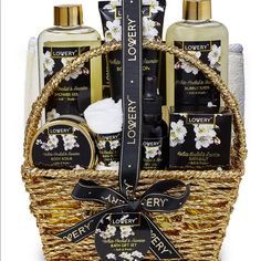 the luxury gift basket is filled with body care products and hand lotion, all wrapped in wicker