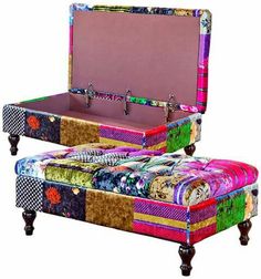 an upholstered bench with colorful fabrics on it