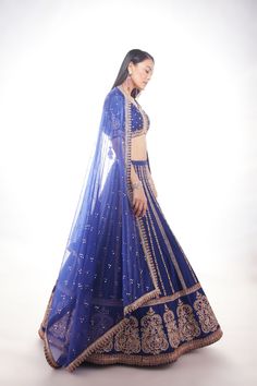 Blue silk lehenga with intricate motifs at the base and delicate lines of zardozi paired with matching blouse and net dupatta with thick main border and thinner borders on 3 sidesFrom Chamee and Palak 's The Wedding Edit collectionDELIVERY TIMEPlease allow 8-12 weeks for your outfit to arrive.FABRIC DETAILSSilk And NetProfessional cleaning only. Blue Anarkali Lehenga With Intricate Embroidery, Blue Intricate Embroidered Anarkali Set For Wedding, Blue Embroidered Anarkali Set For Wedding, Blue Intricate Embroidery Anarkali Set For Wedding, Blue Anarkali Set With Intricate Embroidery For Wedding, Blue Anarkali Set With Intricate Embroidery For Reception, Designer Silk Thread Lehenga With Dupatta, Traditional Blue Gown With Zari Work, Designer Silk Lehenga With Cutdana