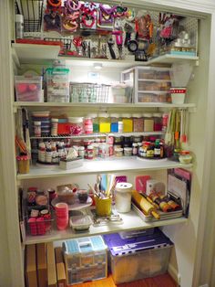 an organized pantry with lots of clutter and crafting supplies on the shelves in it