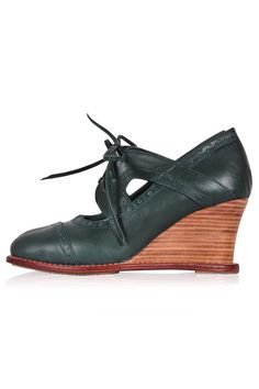 Add a touch of vintage to your outfit with these beautiful Stockholm leather booties. Featuring Oxford styling with a top-stitch accent, rounded toe, leather shoestrings, and hand-cut wooden heels, they can easily be paired with your work attire or your favorite pair of jeans. Leather lining and insole Slightly padded footbed 7.5 cm (3 in) hand-cut wooden wedge Leather and rubber sole Womens Brogues, Oxfords Womens, Oxford Wedges, Oxford Booties, Womens Leather Booties, Elf Shoes, Wooden Wedges, Leather Colors, Wooden Heel