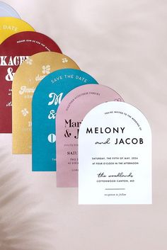 the wedding stationery is laid out on top of each other