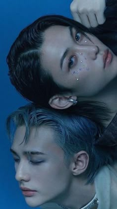 two young men with piercings on their ears