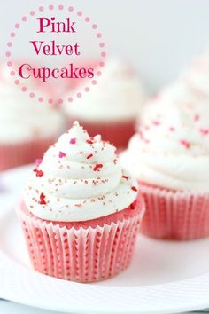 pink velvet cupcakes with white frosting and sprinkles