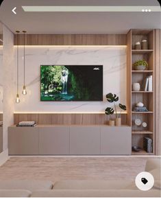 a living room filled with furniture and a flat screen tv mounted on the wall above it