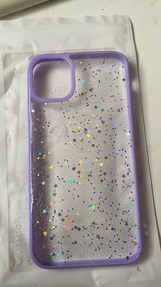 a purple case with glitter stars on it