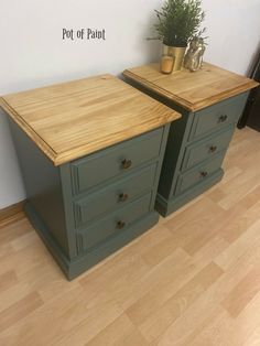 two green dressers side by side on wooden floor next to wall with potted plant