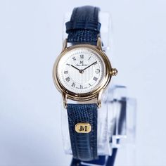 Elevate Your Style With This Stunning Jean Marcel Swiss Made Women's Blue Leather Date Watch. Crafted With Precision And Care, This Wristwatch Boasts A Beautiful Gold And White Dial That Is Sure To Catch The Eye. The Blue Leather Band Complements The Overall Design, Making It Perfect For Any Occasion. This Timepiece Is Water-Resistant Up To 3 Meters And Features A Date Display, Making It A Practical And Stylish Accessory. Made In Switzerland, This Wristwatch Is A Testament To The Country's Reput Timex Watch Women, Bulova Watches Women, Diamond Watches Women, Tank Watch, Timex Watches, Gucci Watch, Fossil Watch, New Bands, Vintage Avon