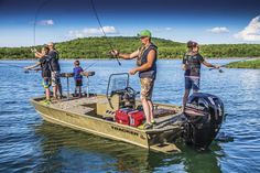 three people on a boat fishing in the water while another man stands next to them