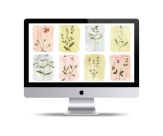 an apple computer with watercolor flowers and leaves on the screen, set against a white background