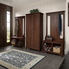 a room with some wooden furniture and a rug on the floor in front of it