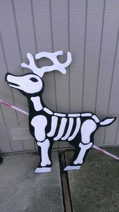 a paper cut out of a skeleton dog