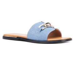 a woman's blue slipper with gold buckles on the front and side