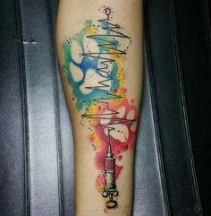 a person with a colorful tattoo on their leg